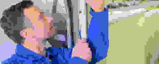 A man repairing garage door