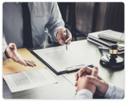 Lawyer reviewing legal documents with a client in an office setting